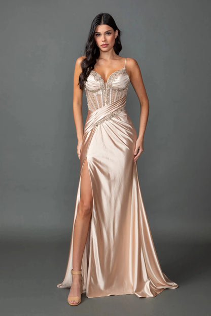 Woman in Champagne prom dress with embellished corset and satin slit skirt.