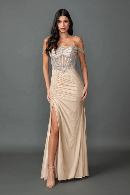Woman in Champagne off-shoulder prom dress with beaded corset and slit skirt.