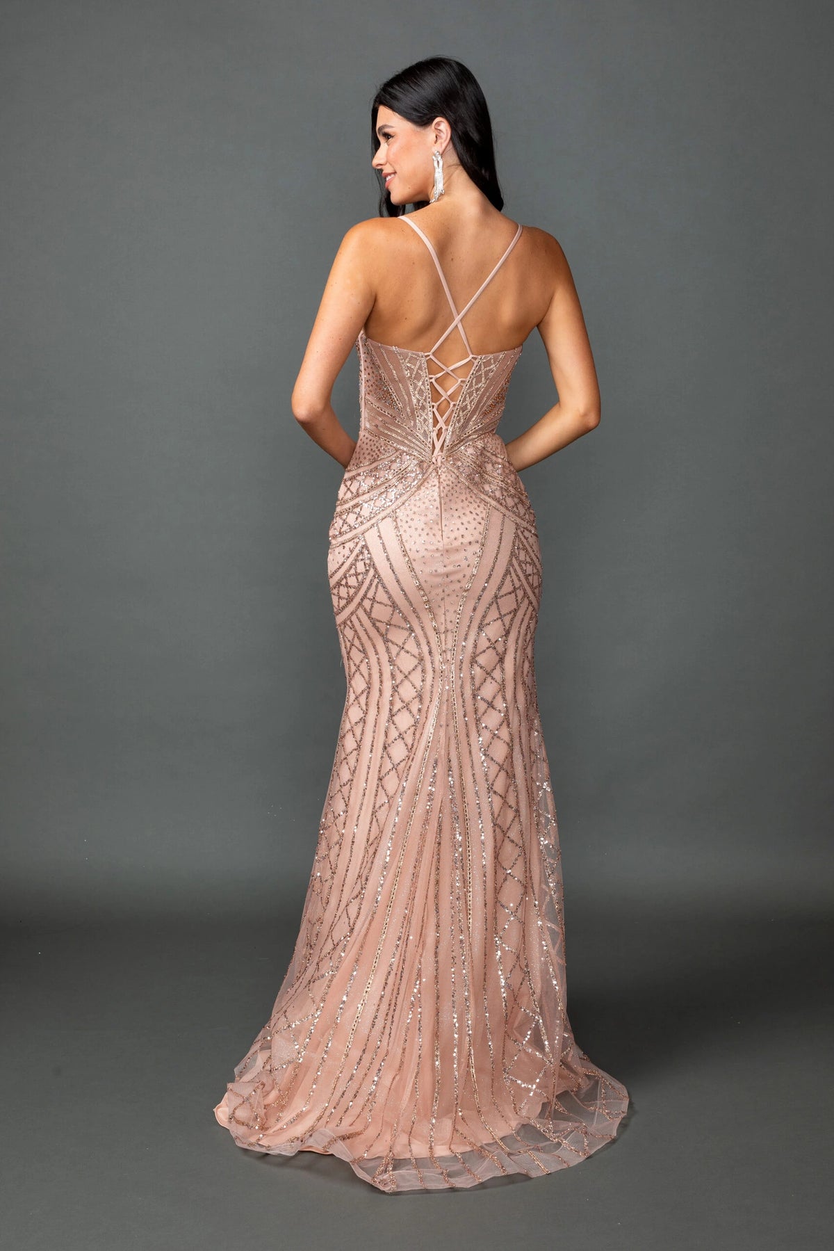 From the back, the Rose Gold prom dress reveals its floor-length skirt.