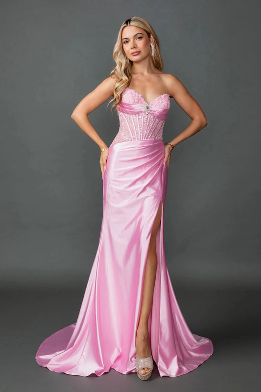 Woman in Pink strapless satin prom dress with beaded corset and slit.