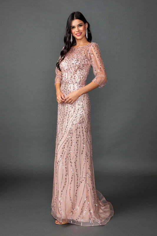 Featuring a floor-length skirt, this Rose Gold prom dress is shown in full view.