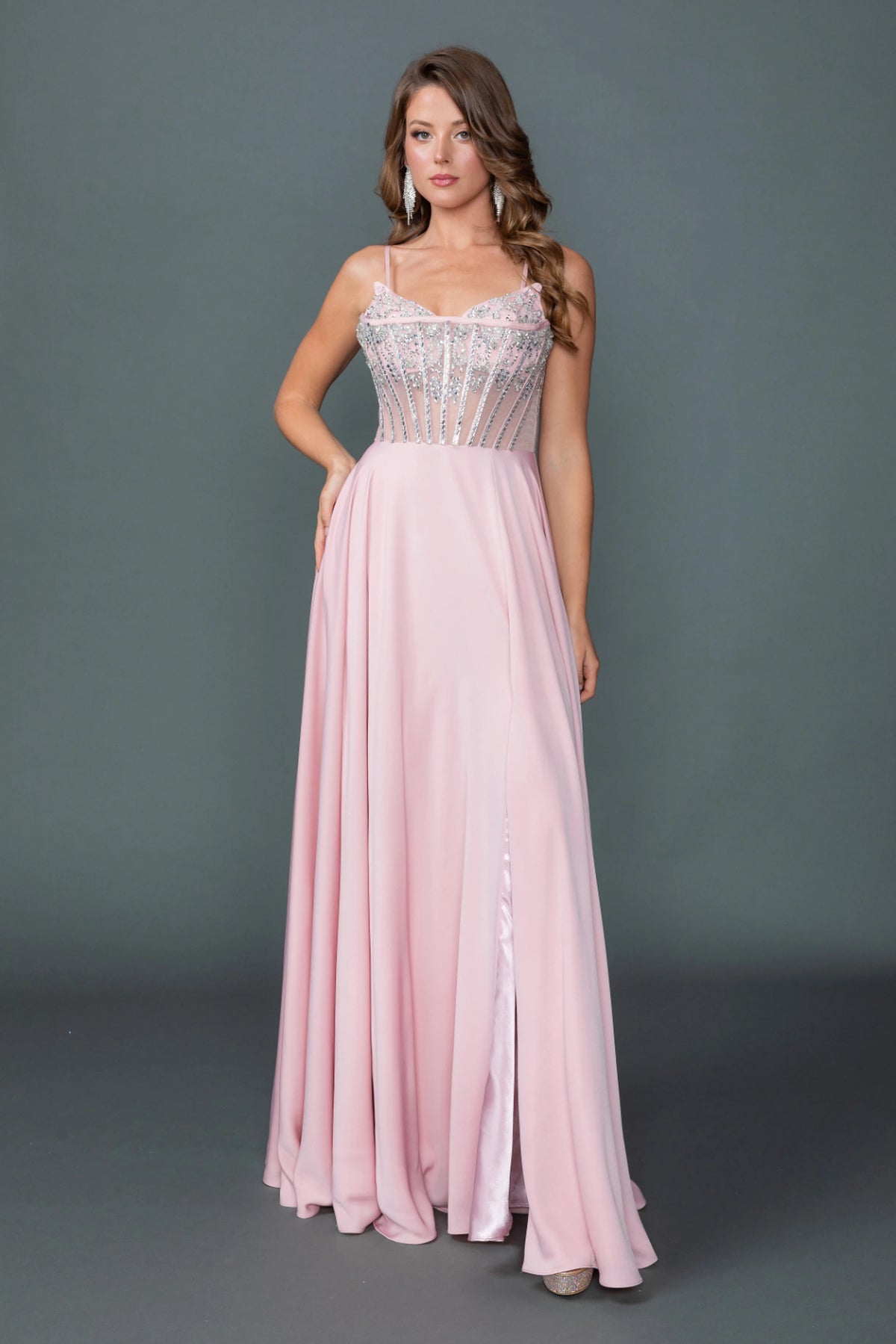 Featuring a floor-length skirt, this Blush prom dress is shown in full view.
