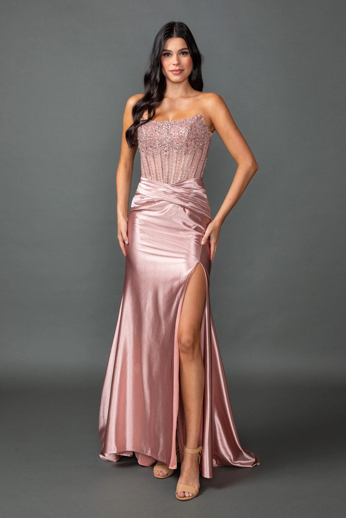 Featuring a floor-length skirt, this Rose Gold prom dress is shown in full view.