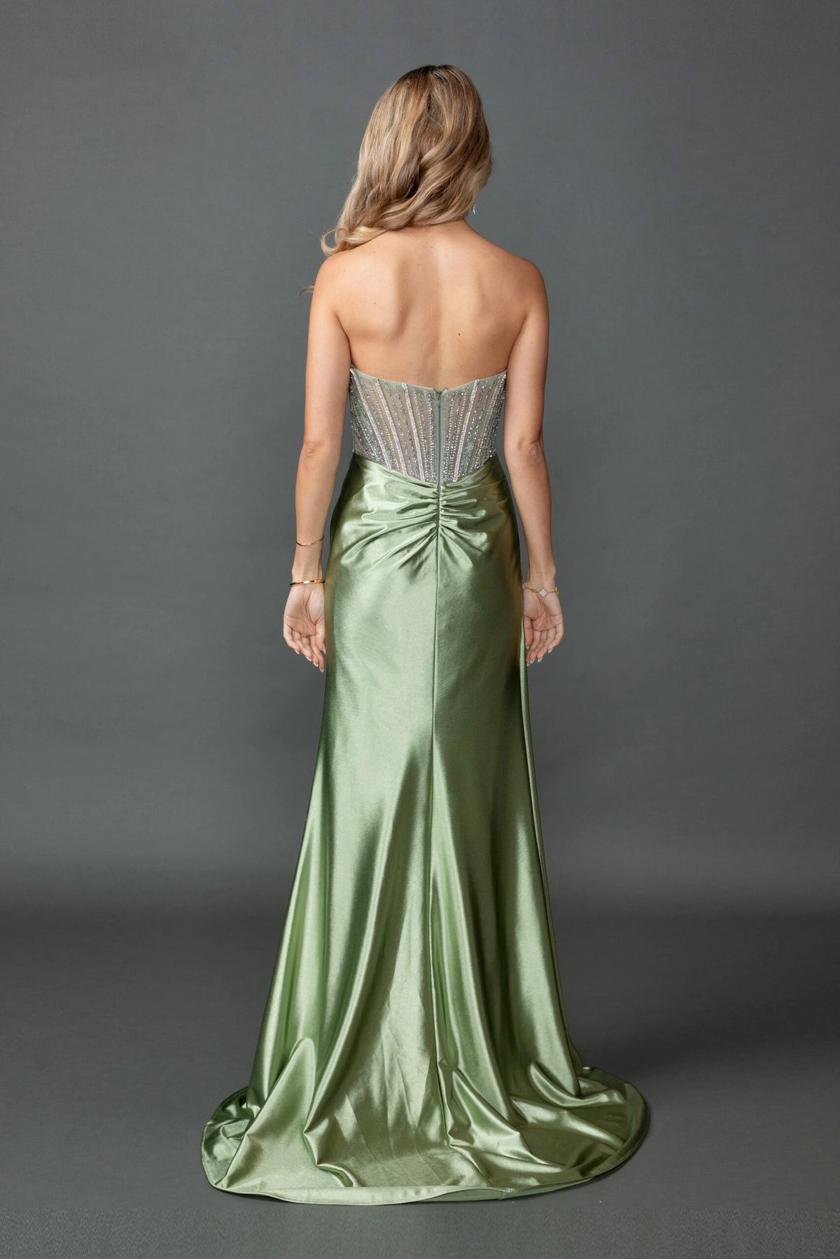 From the back, the Olive prom dress reveals its floor-length skirt.
