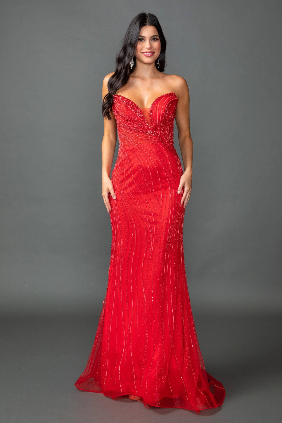 Featuring a floor-length skirt, this Red prom dress is shown in full view.