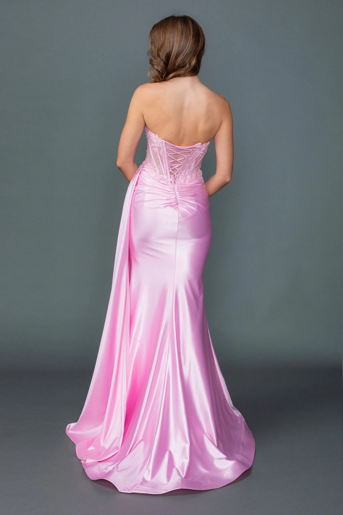 From the back, the Pink prom dress reveals its floor-length skirt.