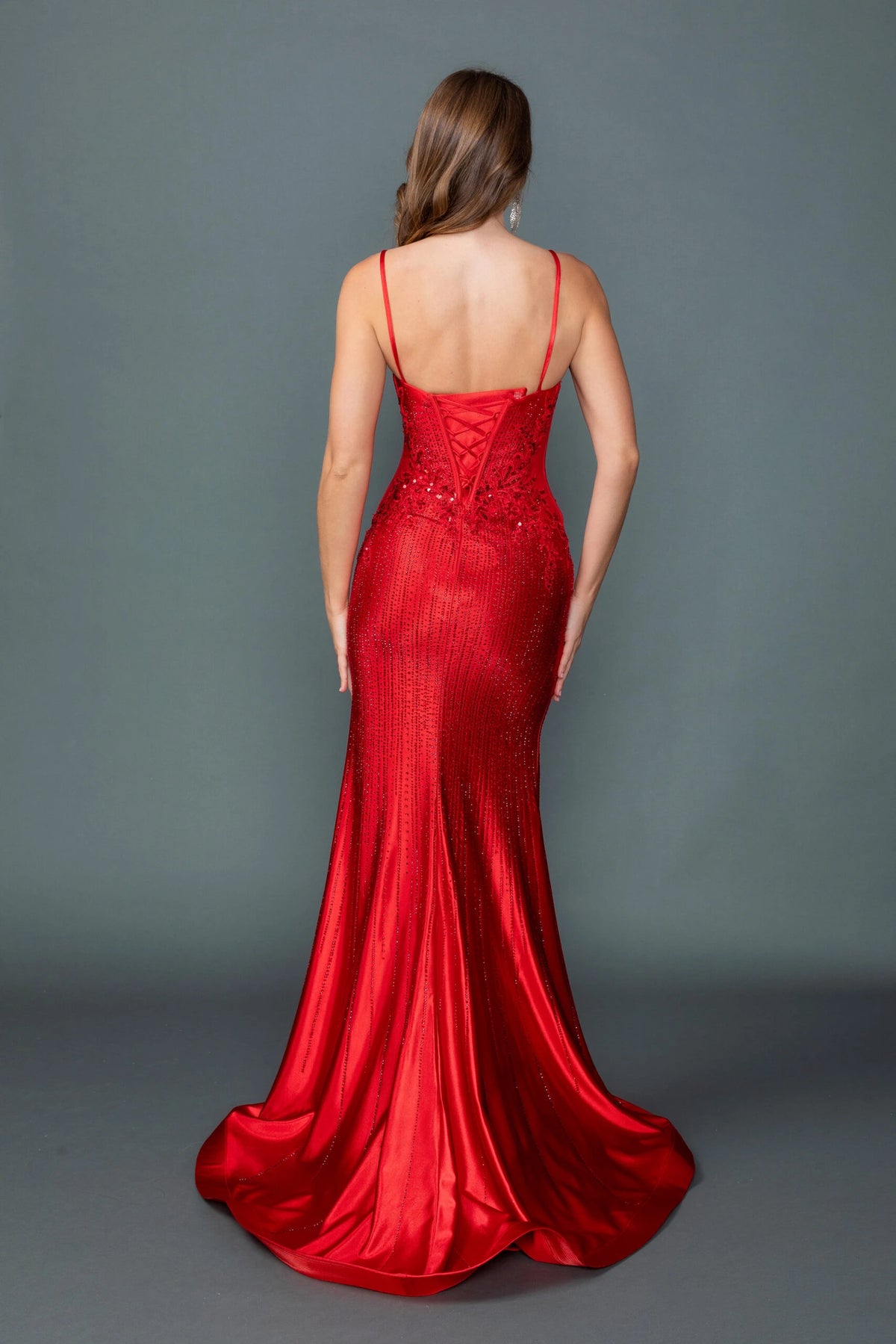 From the back, the Red prom dress reveals its floor-length skirt.