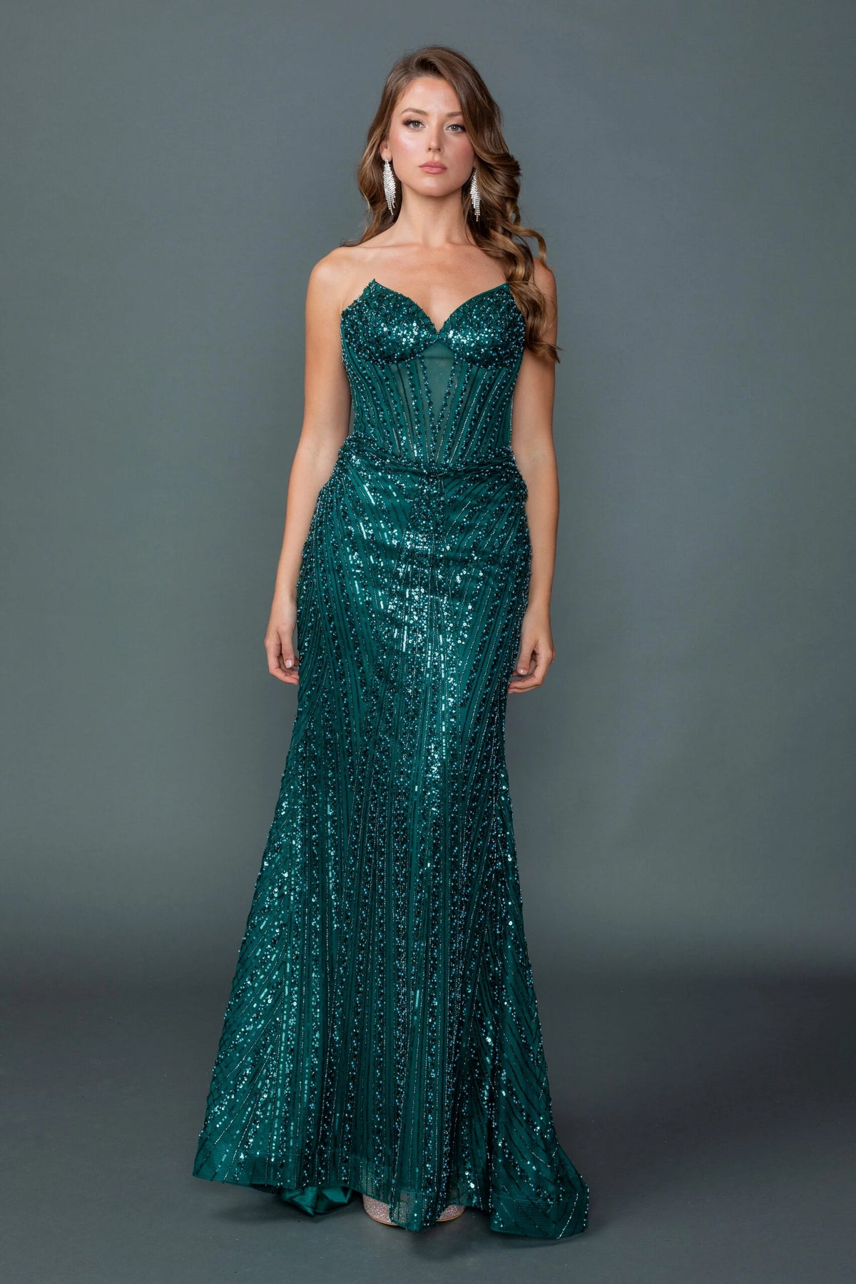 Featuring a floor-length skirt, this Hunter Green prom dress is shown in full view.