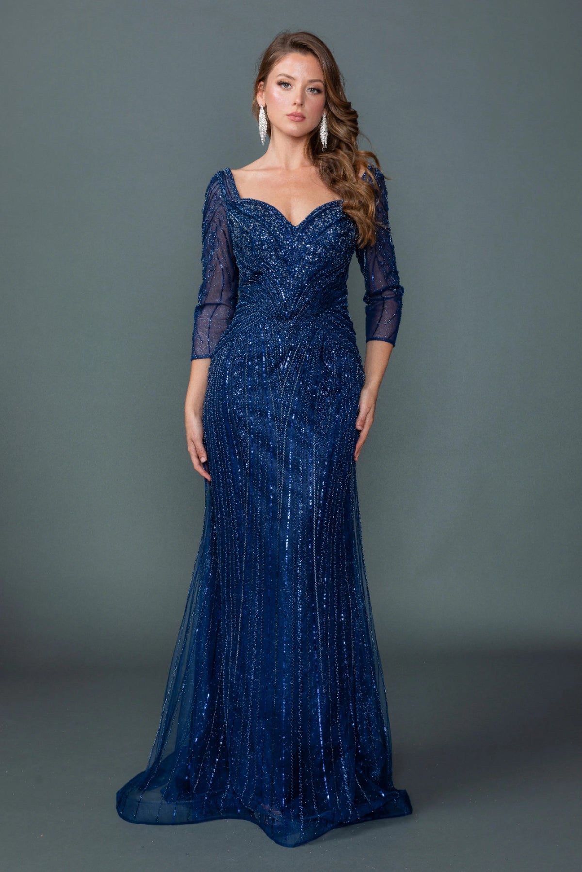 Featuring a floor-length skirt, this Navy prom dress is shown in full view.