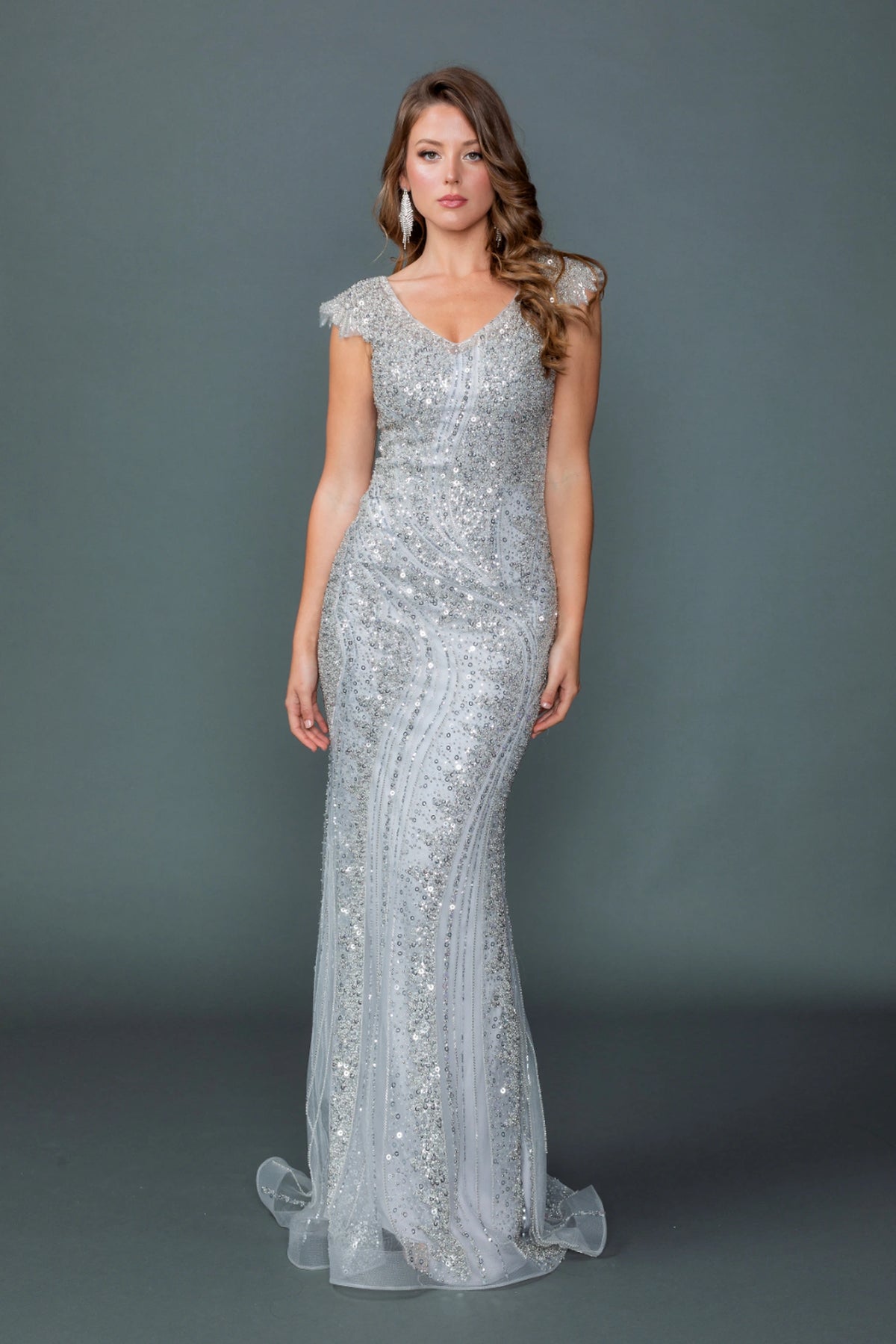 Featuring a floor-length skirt, this Silver prom dress is shown in full view.