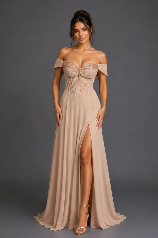 Featuring a floor-length skirt, this Champagne prom dress is shown in full view.