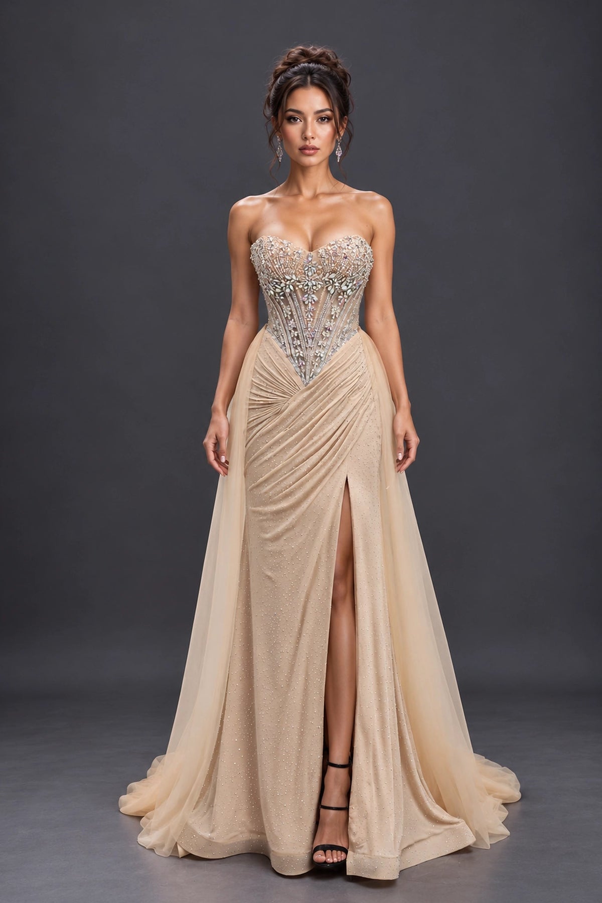 Featuring a floor-length skirt, this Champagne prom dress is shown in full view.