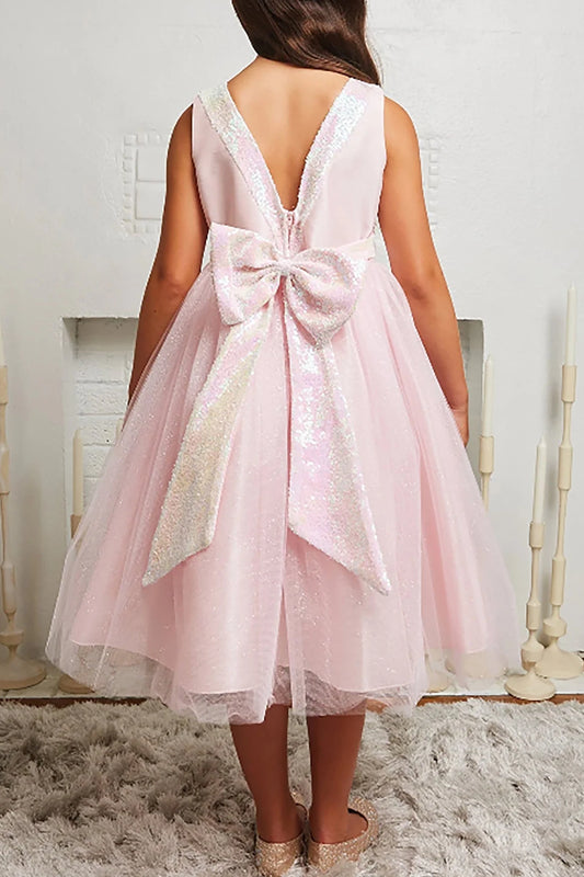 Pink flower girl dress with a large bow on the back.
