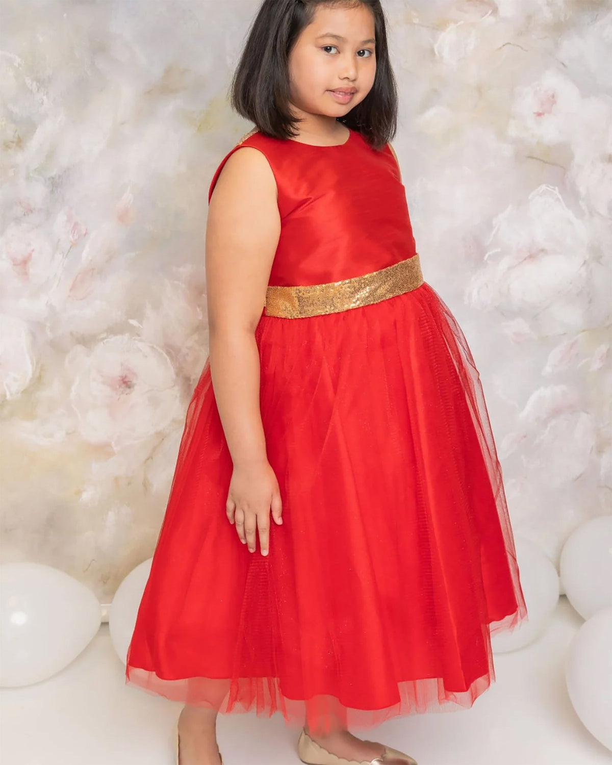 A red flower girl dress with a gold belt.