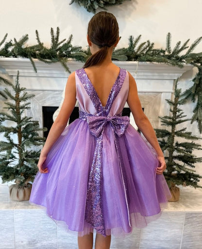 Lilac USA Made | Sequin V-Back Tulle Flower Girl Dress with detachable Ribbon pin - back view of girl wearing dress with bow