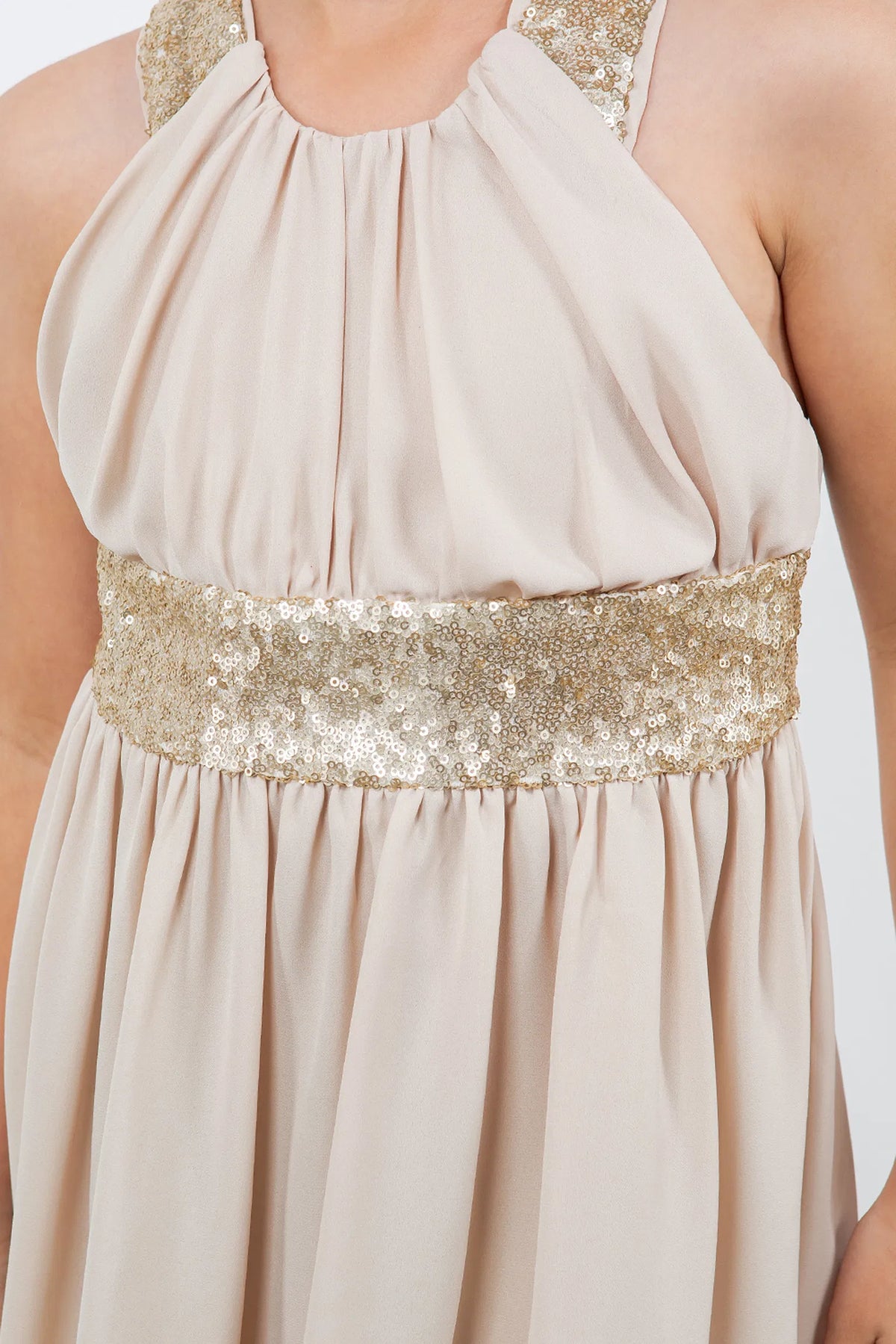 Finished details of crossed sequin-trimmed back straps distinguish the Champagne kids party dress.