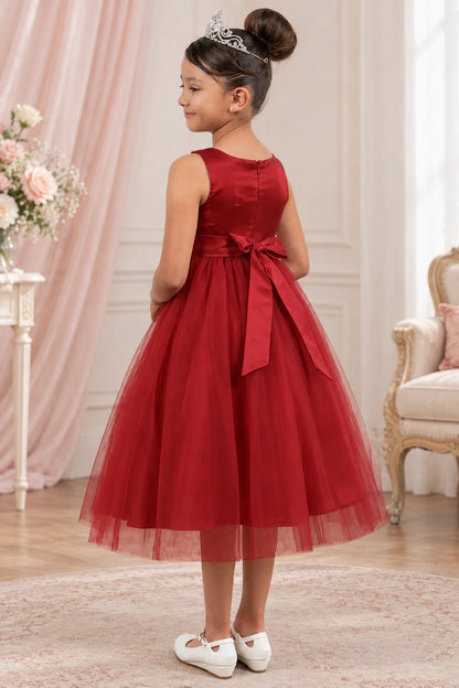 Burgundy flower girl dress seen from behind with a center zipper and long bow tails.