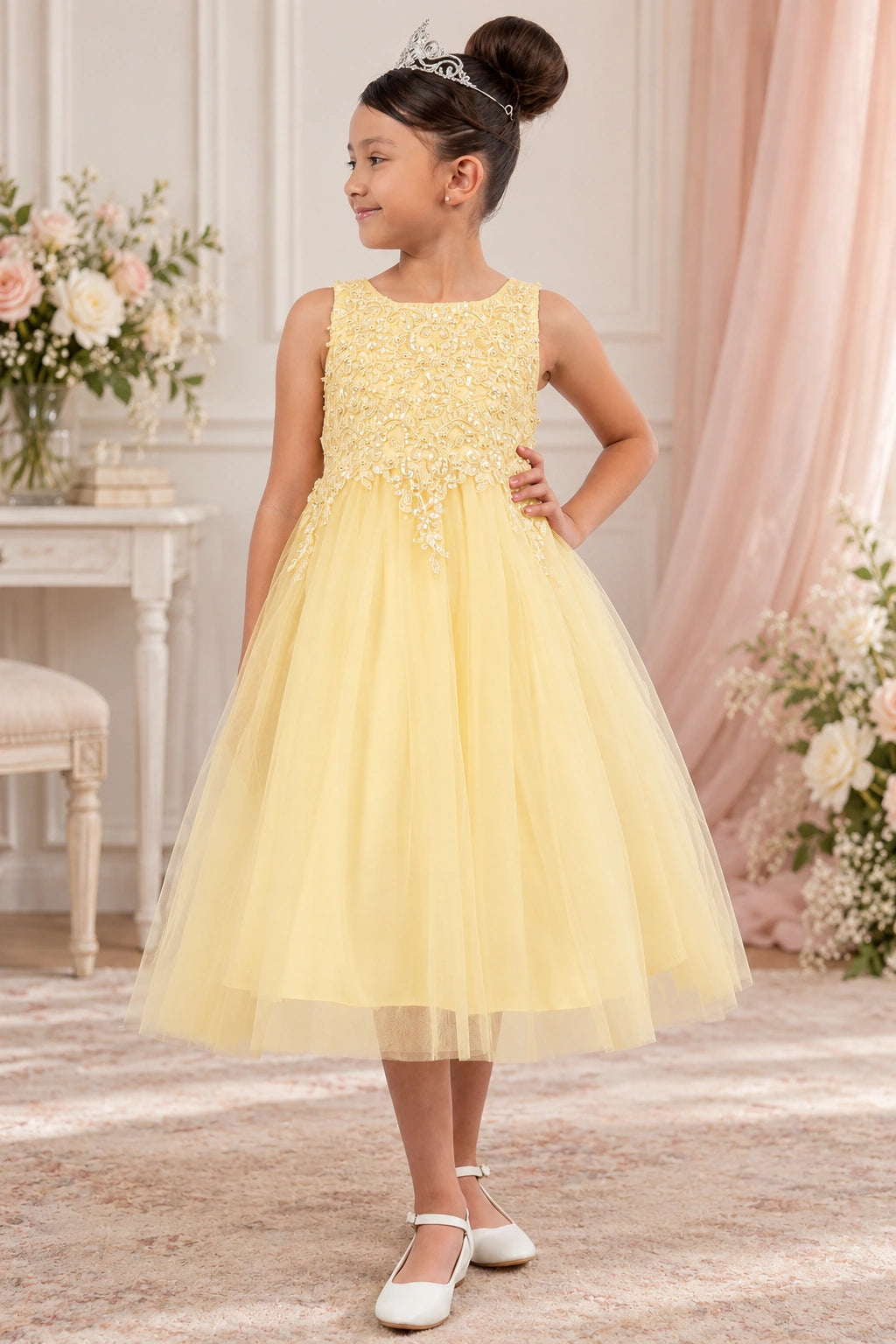 Champagne flower girl dress pairs a rounded neckline with a full tulle skirt.