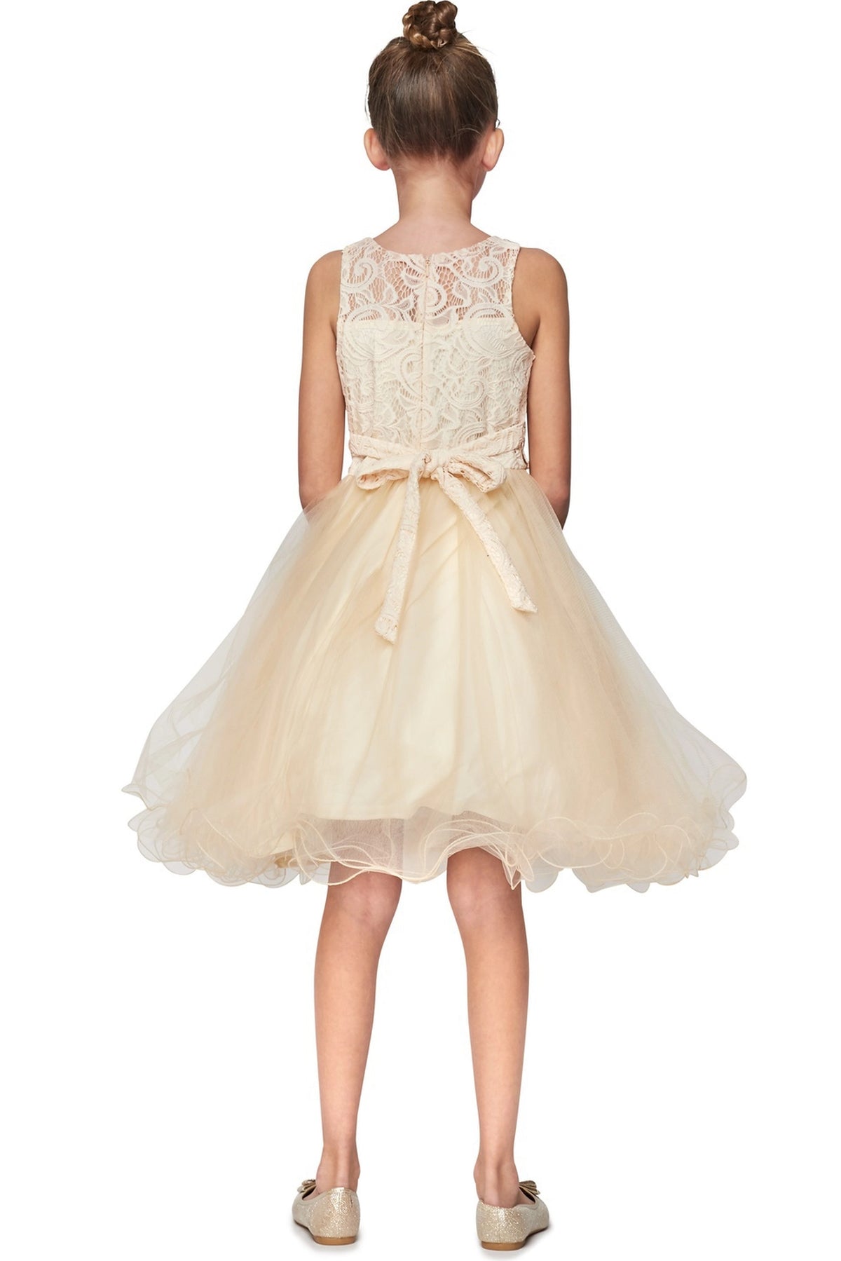 Finished details of a lace back and satin bow distinguish the Champagne kids party dress.
