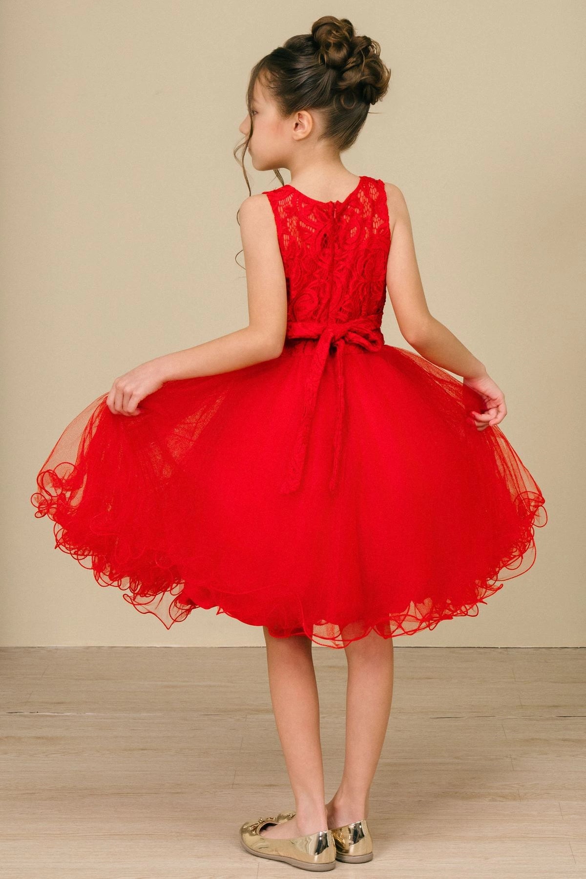 Showcasing with a lace back and satin bow, this Red kids party dress displays elegant detail.