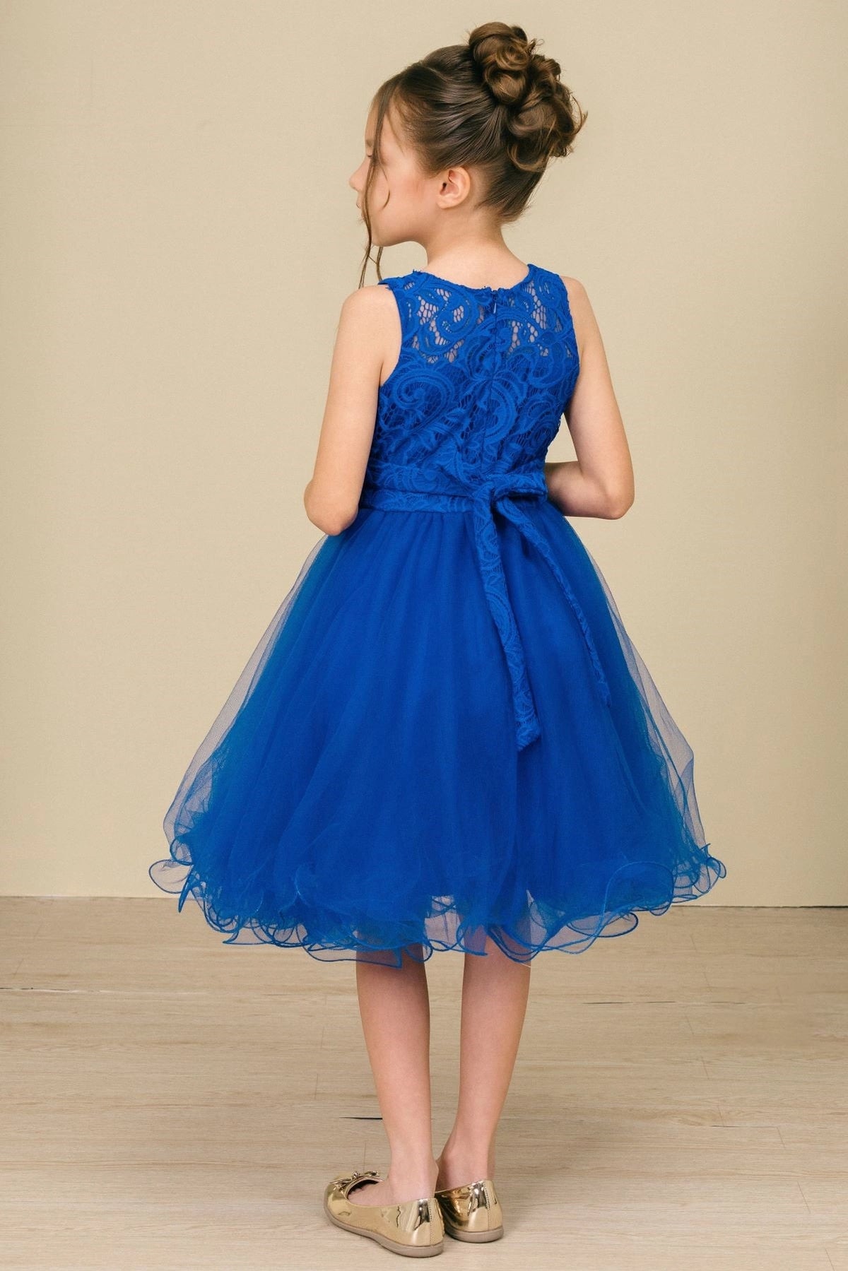 Showcasing with a lace back and satin bow, this Royal Blue kids party dress displays elegant detail.