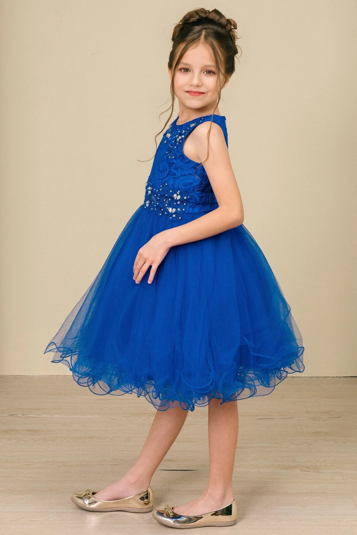Finished details of a lace back and satin bow distinguish the Royal Blue kids party dress.