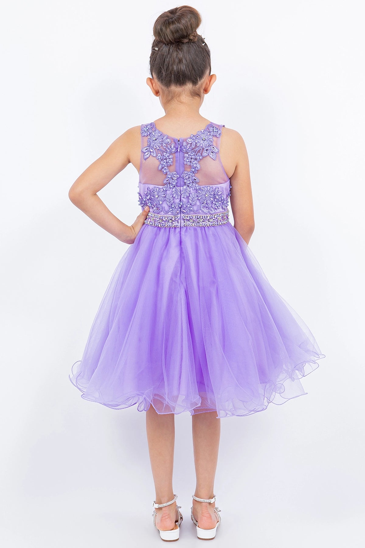 Finished details of a lace-framed back opening distinguish the Lilac kids party dress.