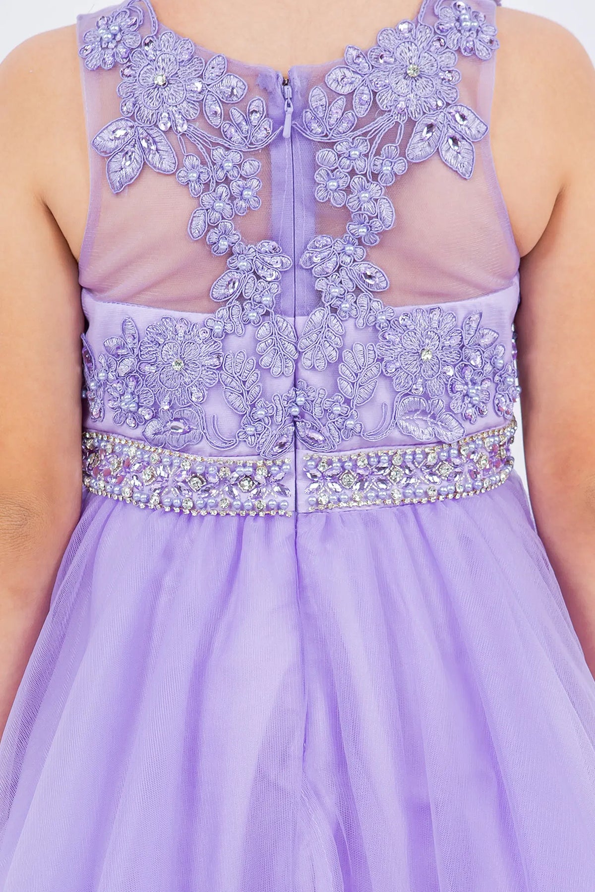 Detailed by raised floral bodice appliques, the Lilac kids party dress reveals its construction.