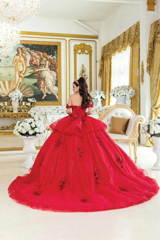 Back view of red quinceañera ball gown featuring lace-up corset back, layered ruffle detail, and sweeping glitter tulle skirt with embroidered accents.