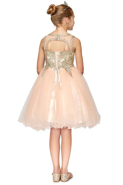 Blush flower girl dress back view highlighting flowing tulle skirt and elegant silhouette.