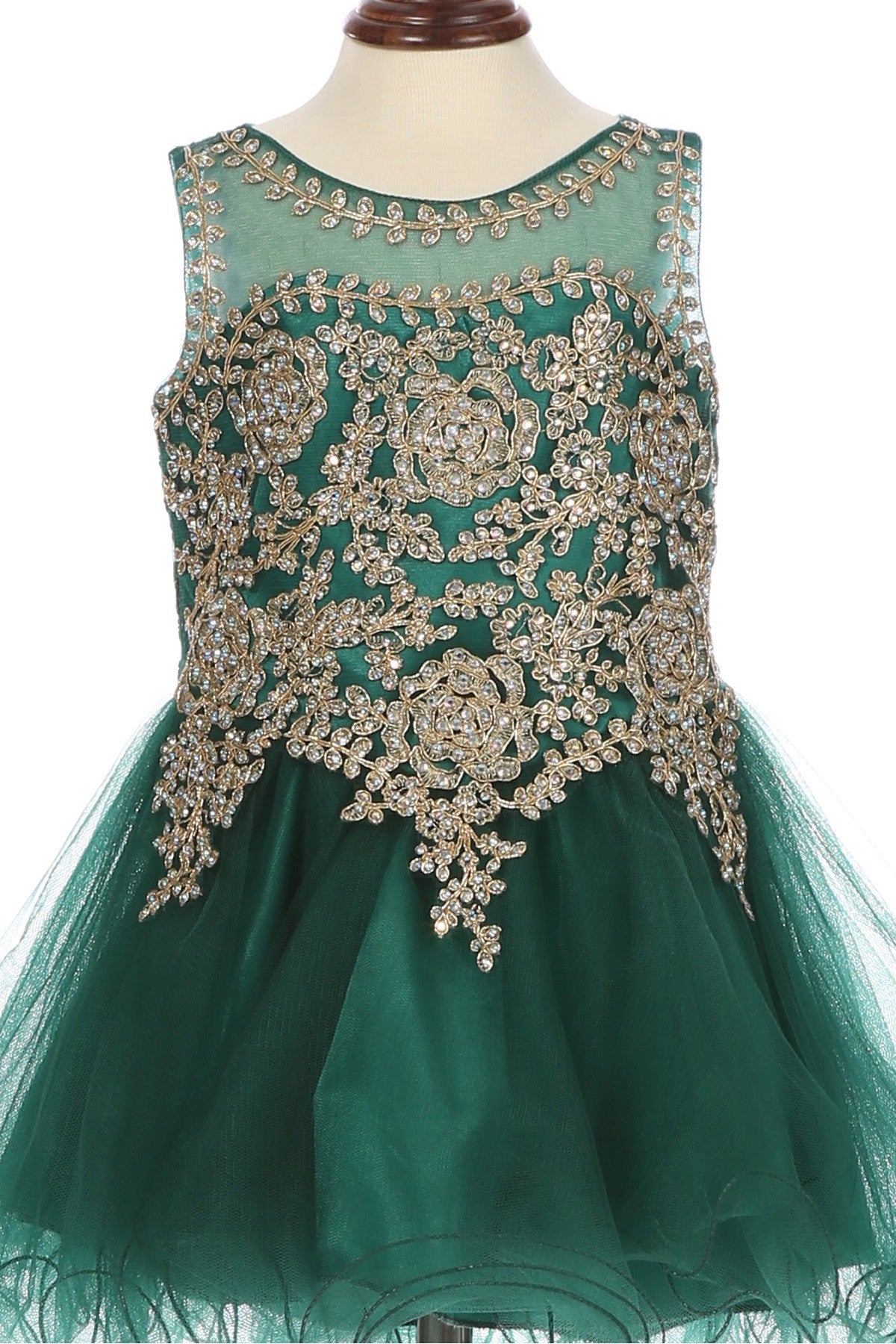 Close-up front view of hunter green flower girl dress showing floral applique and pearl detail.