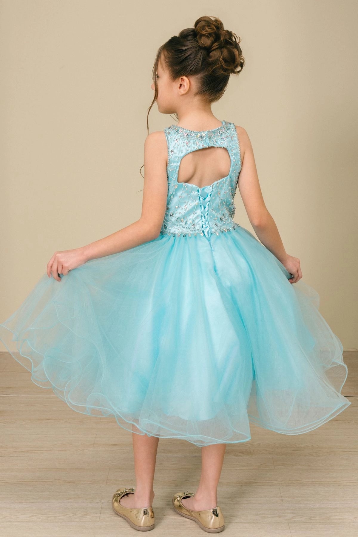 Finished details of a beaded keyhole back distinguish the Aqua kids party dress.