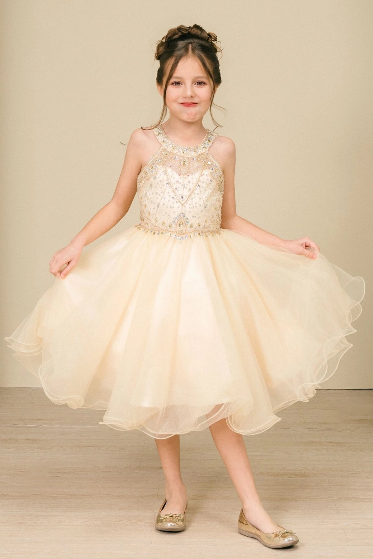 Showcasing with crystal beading across the bodice, this Champagne kids party dress displays elegant detail.