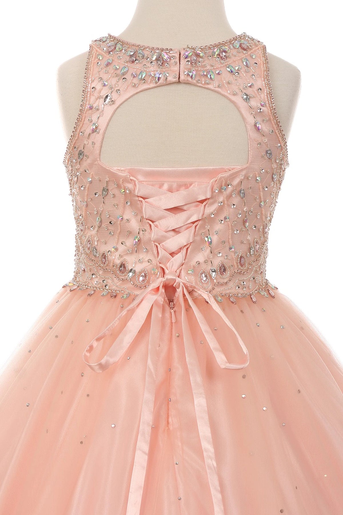 Featured on this Blush mini quince dress: a keyhole upper back with satin lacing.