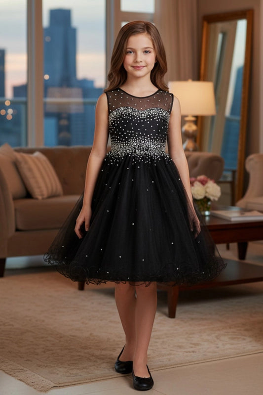 Finished details of a layered tulle skirt distinguish the Black kids party dress.