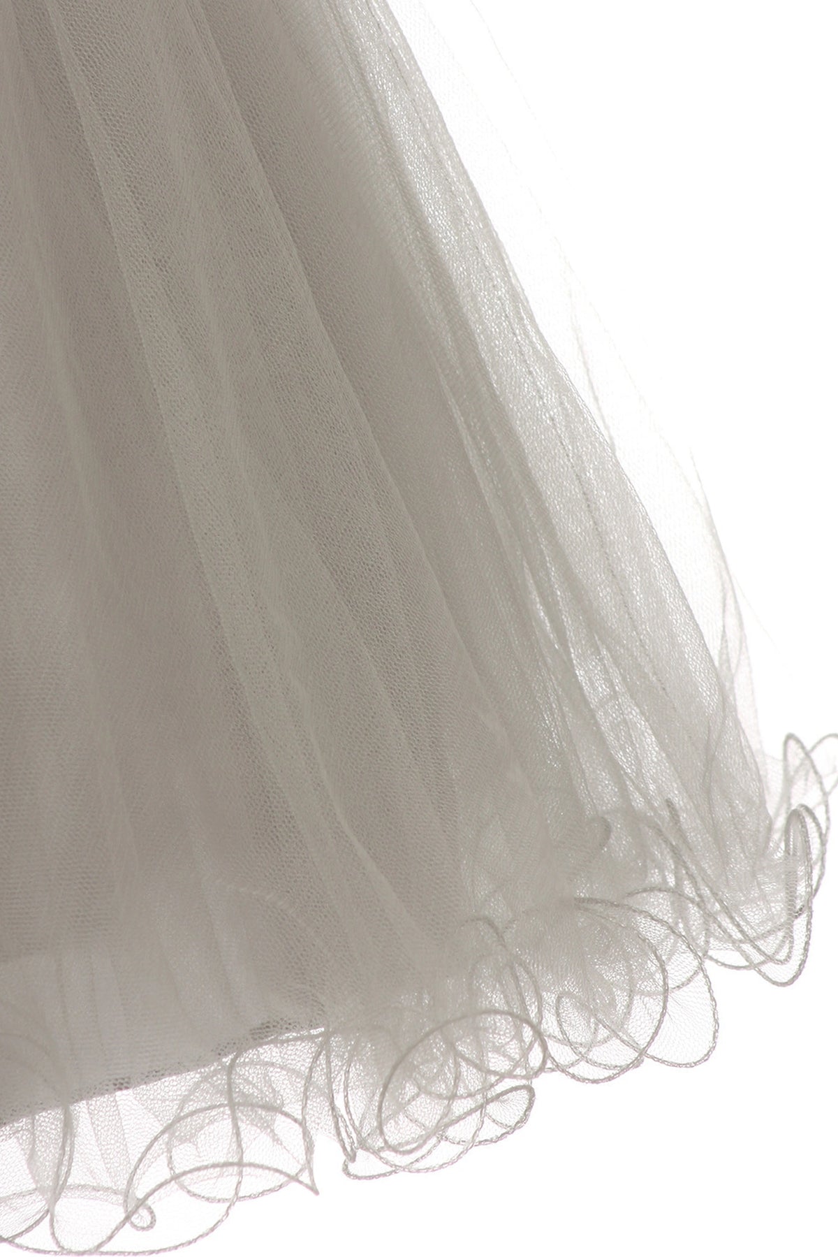 Highlighting curled tulle hem edging on the Silver kids dress.