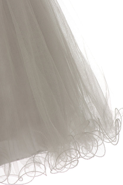 Highlighting curled tulle hem edging on the Silver kids dress.