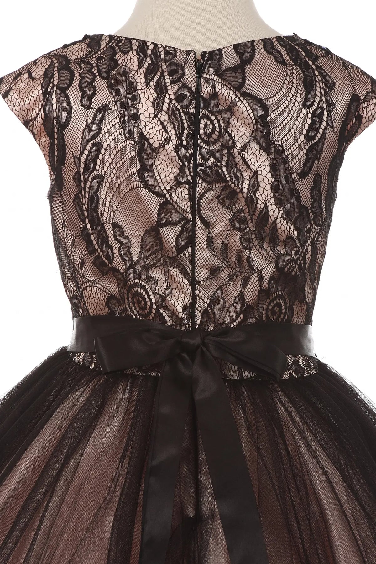 Sheer floral lace and a tied waist sash detail the back of this Black/Blush kids party dress.
