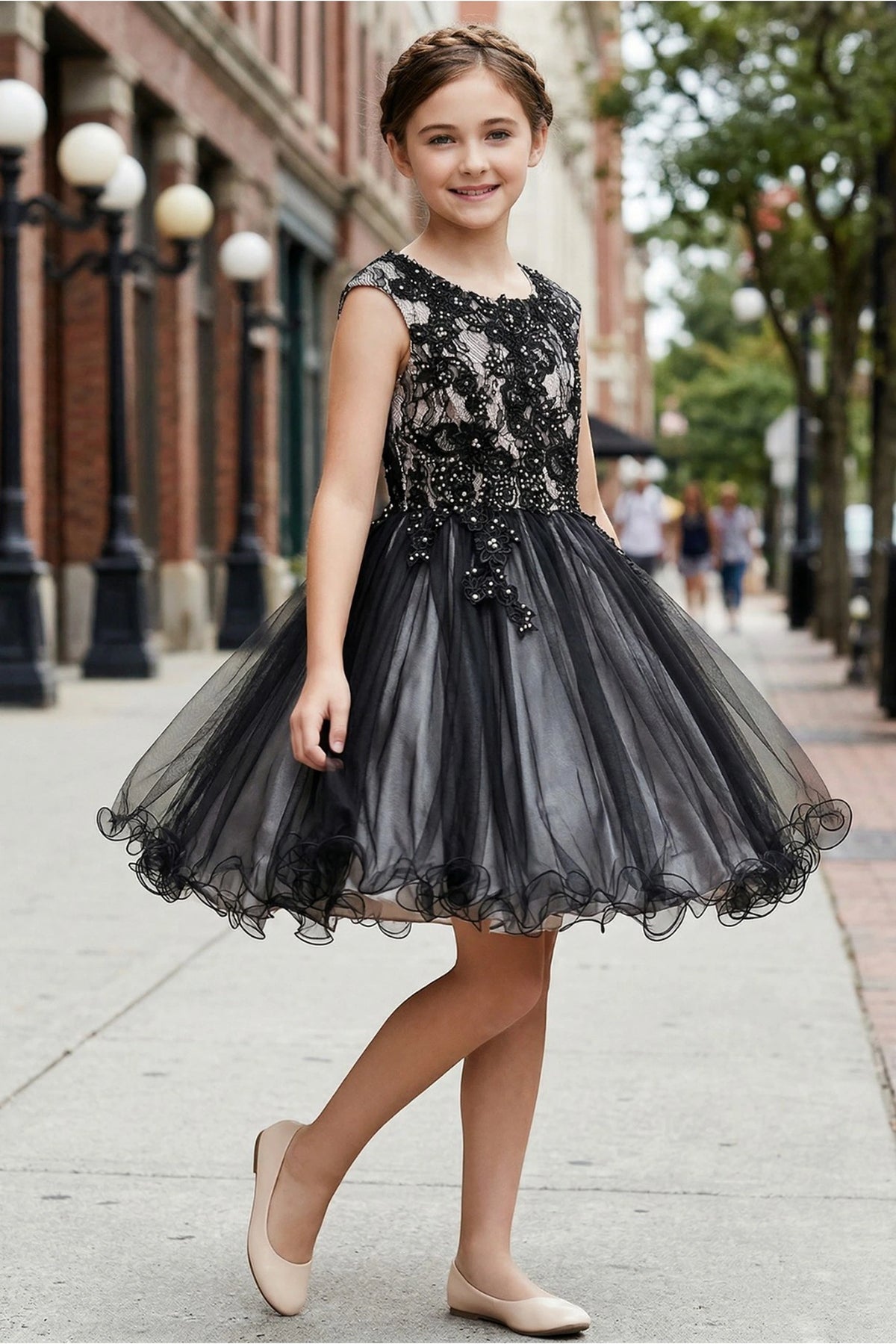 Finished details of a full satin skirt with a tulle edge distinguish the Black/Silver kids party dress.