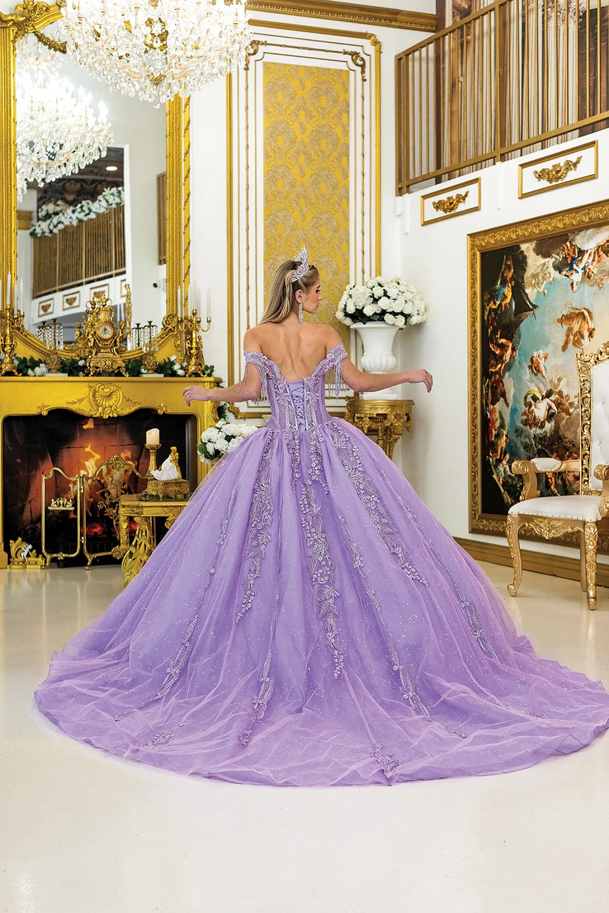 Back view of a Lilac quinceañera gown showing lace-up back, detachable sleeves, and full tulle skirt