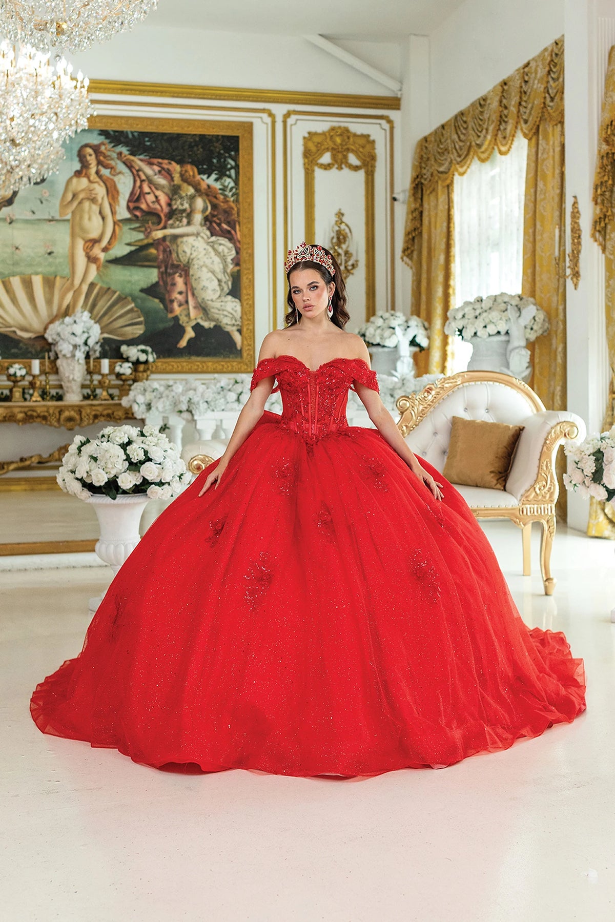 Front view of a Red quinceañera gown with off-the-shoulder neckline, beaded corset bodice, floral appliqués, and glitter tulle skirt