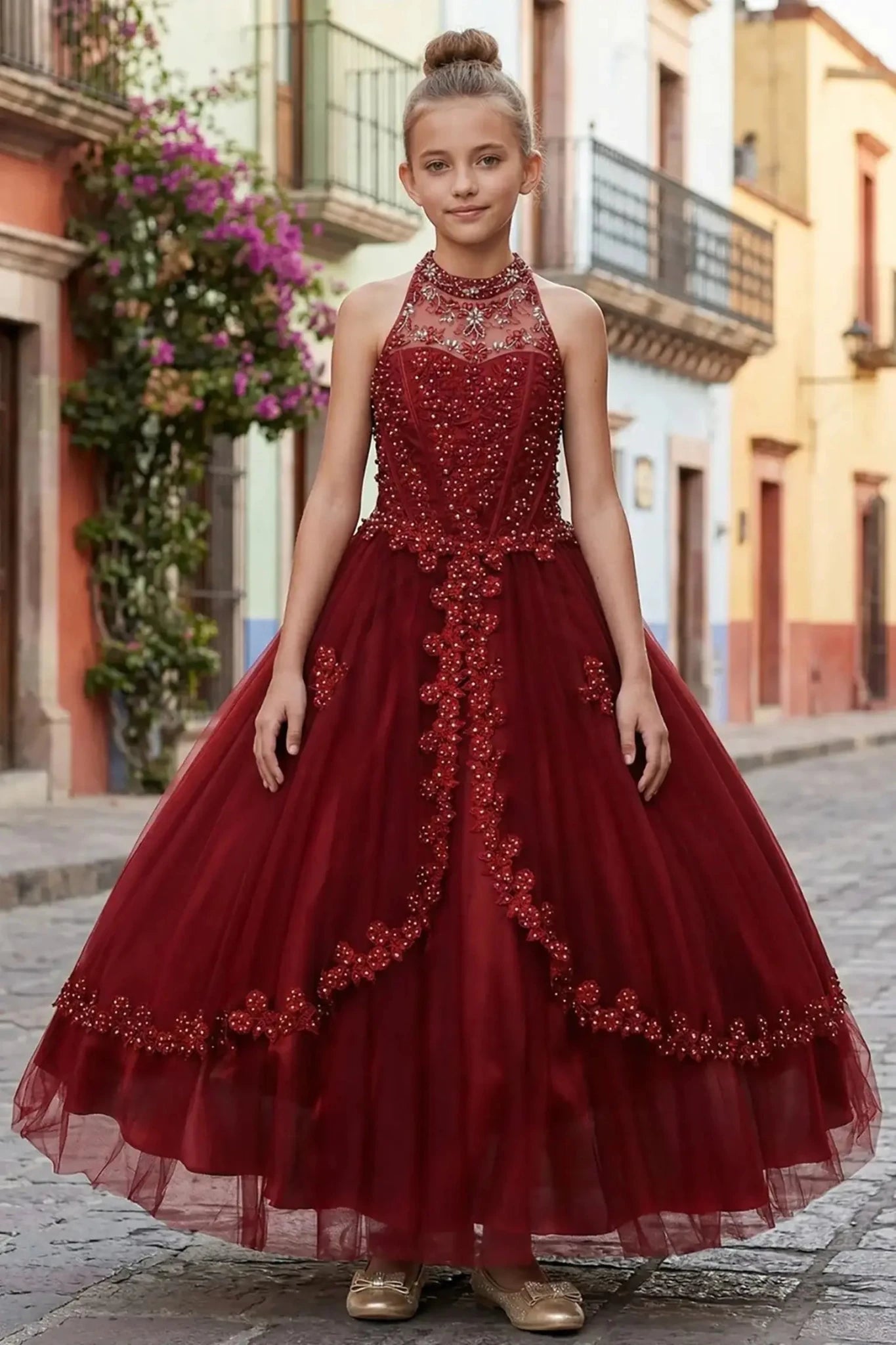 Burgundy front view kids mini quinceañera mini quince dress with halter neck, rhinestones, pearls and layered tulle skirt.