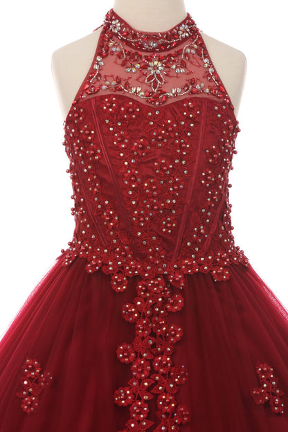 Rear view reveals burgundy kids mini quinceañera mini quince dress with halter neck, rhinestones, pearls and layered tulle skirt.