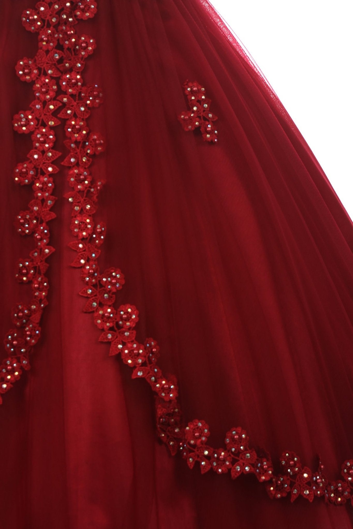 Burgundy skirt view kids mini quinceañera mini quince dress with halter neck, rhinestones, pearls and layered tulle skirt.