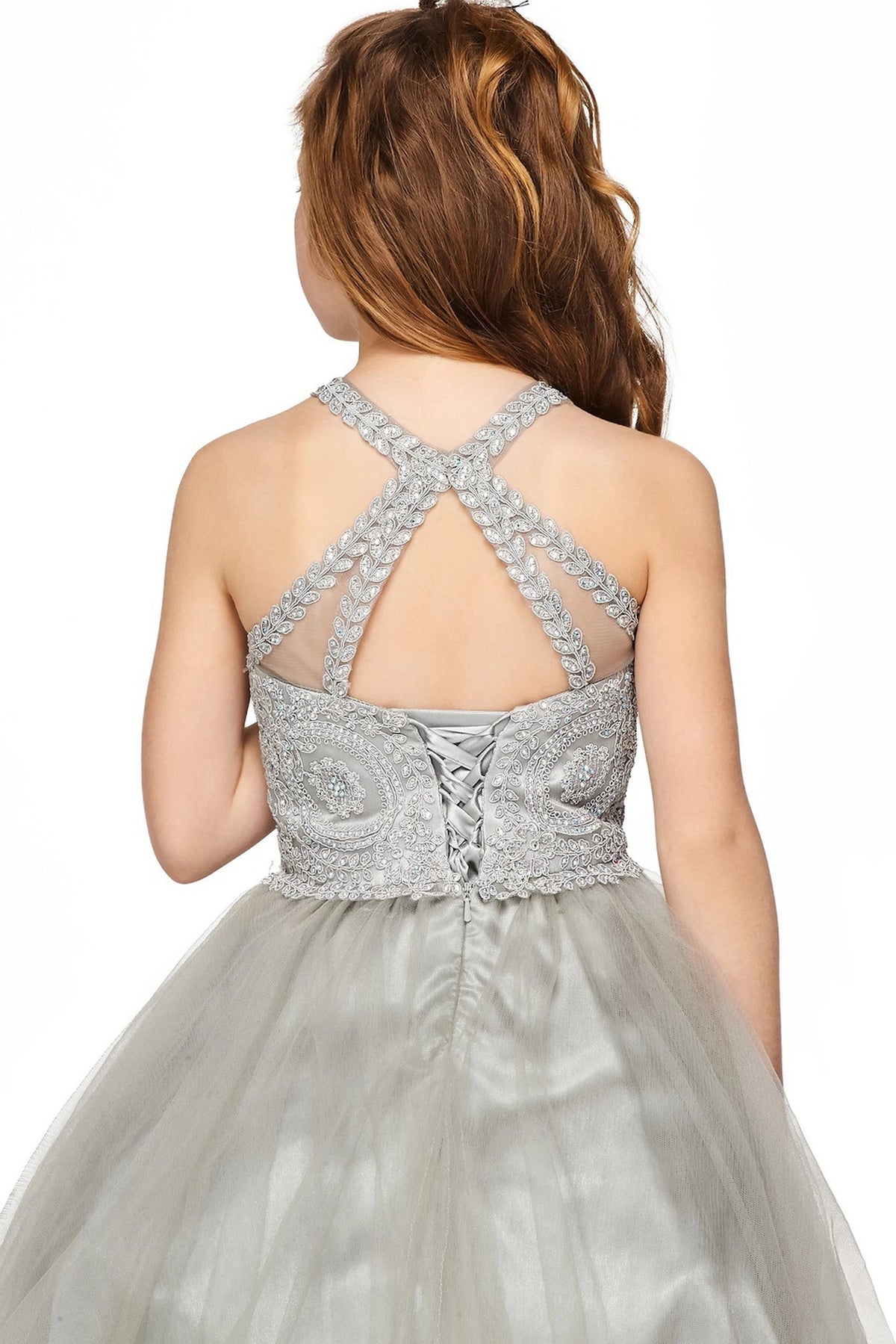 Showcasing with crossed halter straps, this Silver kids party dress displays elegant detail.