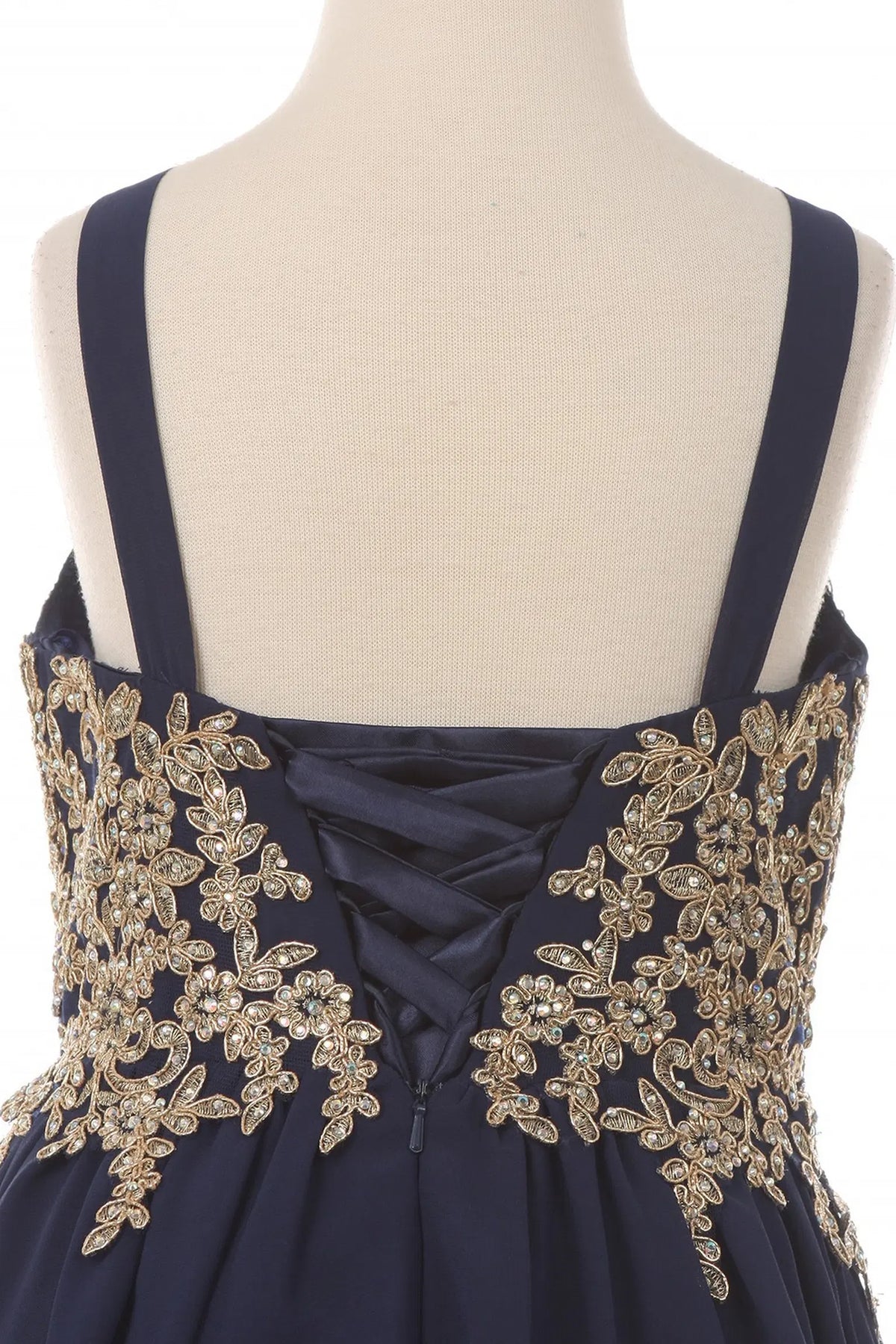 Detailed by floral appliques framing back lacing, the Navy kids party dress reveals its construction.
