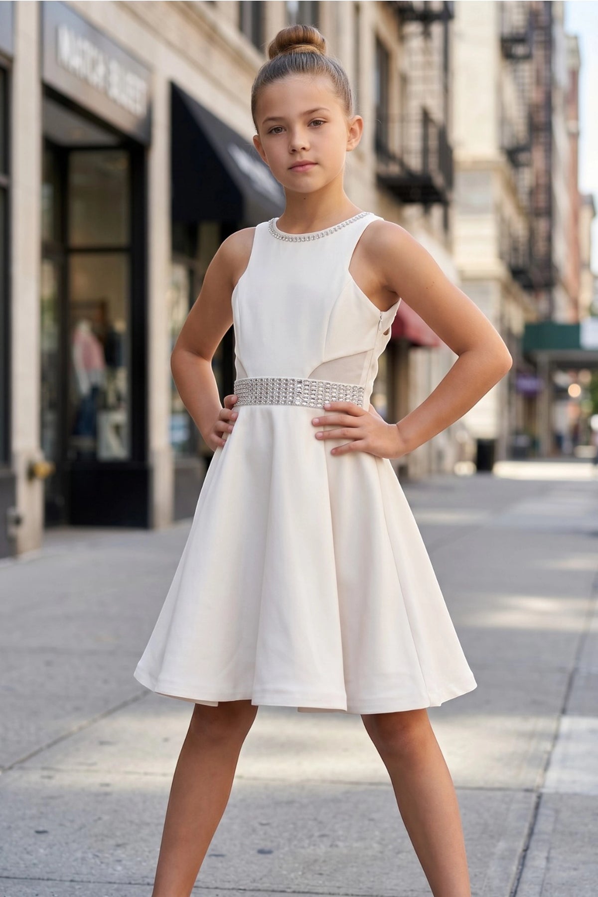Showcasing with a crystal-trimmed waistband, this Off-White kids party dress displays elegant detail.
