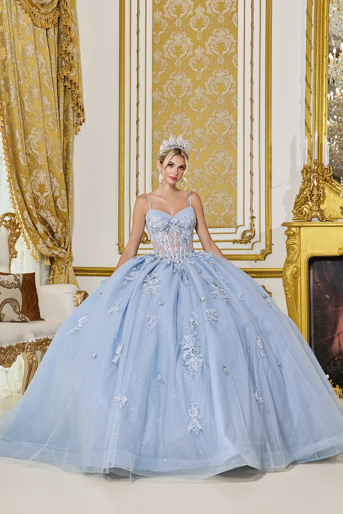 Front view of a Dusty Blue quinceañera gown with sweetheart neckline, sheer corset bodice, floral appliqués, and glitter tulle skirt