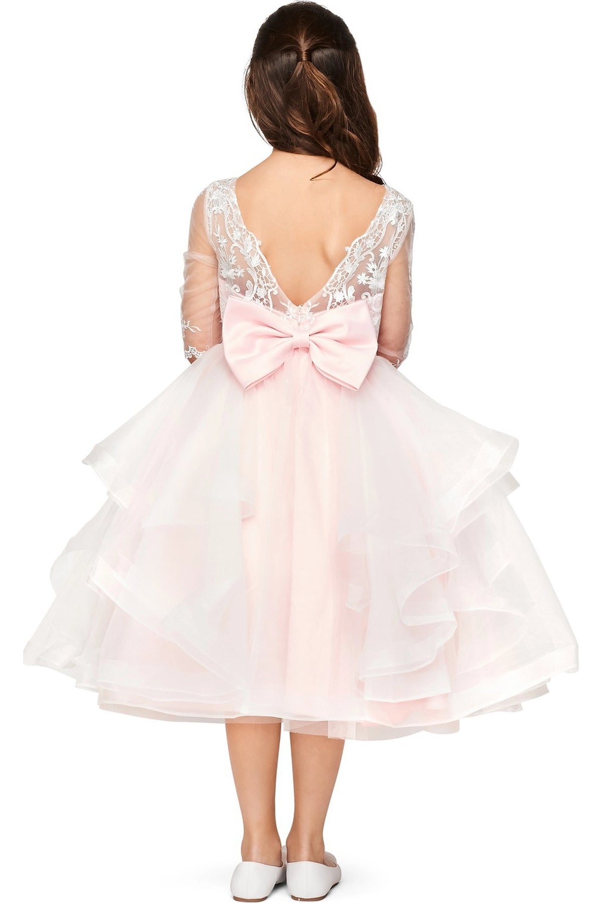Detailed by a V-shaped lace back and large bow, the Pink kids party dress reveals its construction.