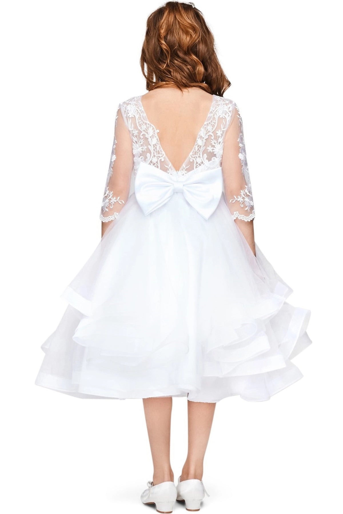 Finished details of a V-shaped lace back and large bow distinguish the White kids party dress.